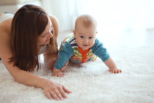 Cairns carpet cleaning service showcasing steam cleaned carpet with mother and baby
